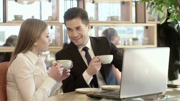 man and woman face to face meeting in coffee shop
